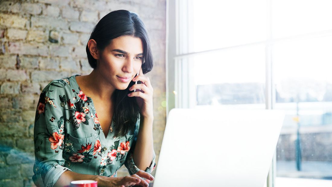 Woman using a computer to research is disability insurance a good idea.