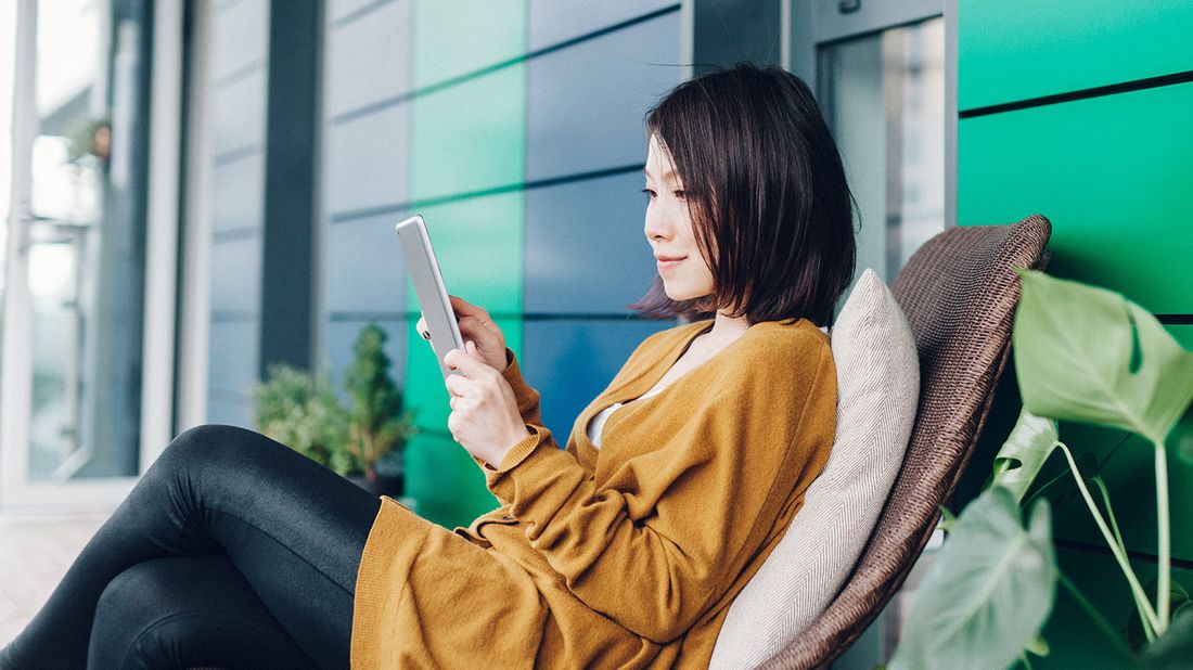 Woman looking up a smart investing strategy