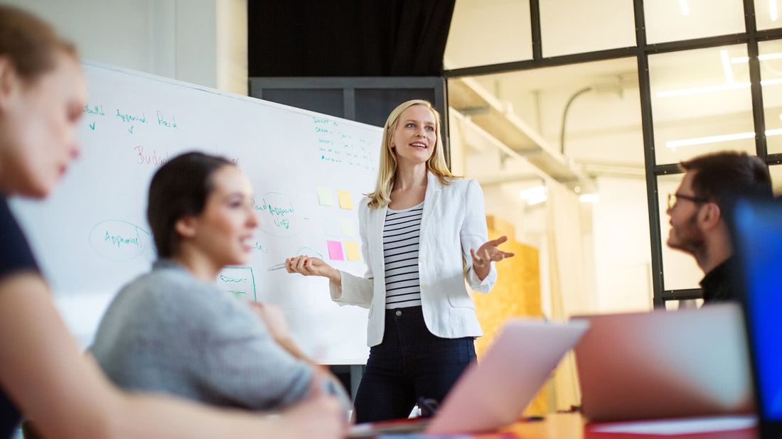 Woman giving a presentation on when it makes sense to take a pay cut