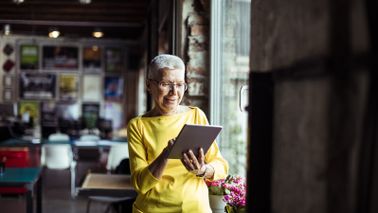 Woman reading Northwestern Mutual Market Commentary