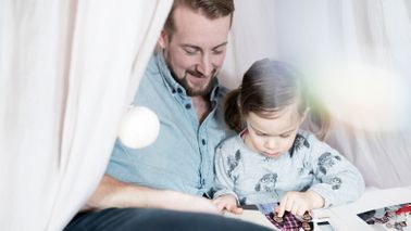 Father and daughter deciding what not to throw away when decluttering
