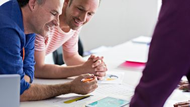 colleagues discussing business plan