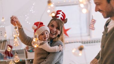 new parents celebrating the holidays with baby