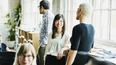 Key employee business women talking in business meeting