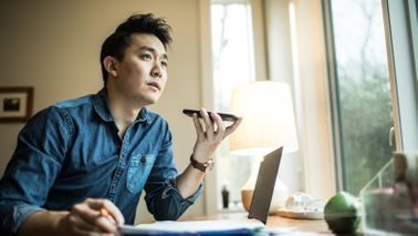 A man discusses is group disability insurance policy over the phone