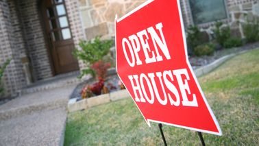 open house sign outside home for sale