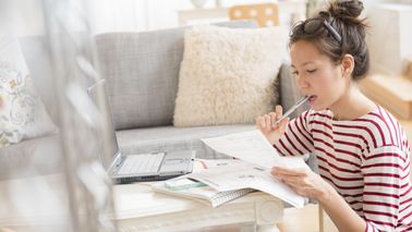 woman reading about commonly misunderstood financial terms