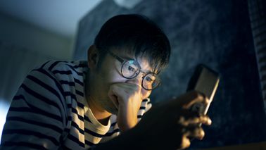 Man reading news about recent market volatility