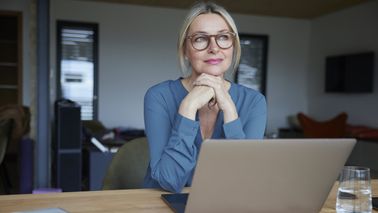Woman thinking about earning high yields on investment-grade bonds