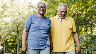 retired-couple-walking-in-park