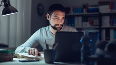 Man reading Northwestern Mutual’s weekly market commentary.