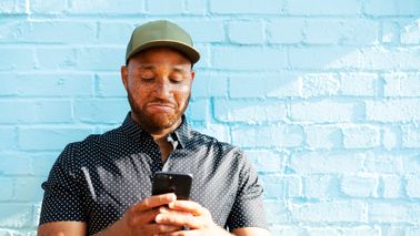 Man reading Northwestern Mutual’s Weekly Market Commentary.