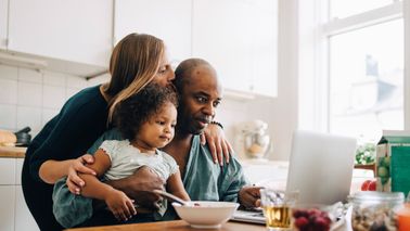 A couple with their child researching the marriage tax penalty
