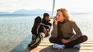 Couple thinking on pier