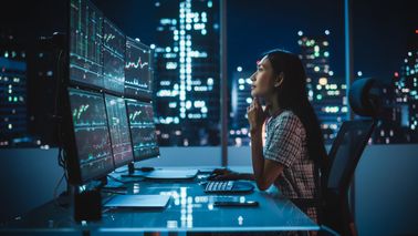 Woman thinking about what she read in Northwestern Mutual's Asset Allocation Focus.