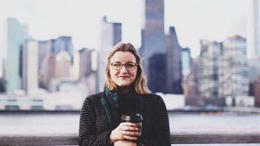 woman standing with city background