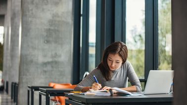 Woman studying in library