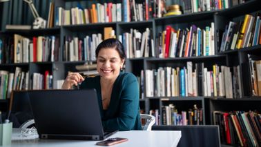 Woman reading Northwestern Mutual Market Commentary