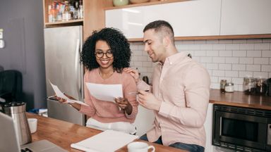 Couple doing their taxes and discussing a strategy to bunch itemized deductions 