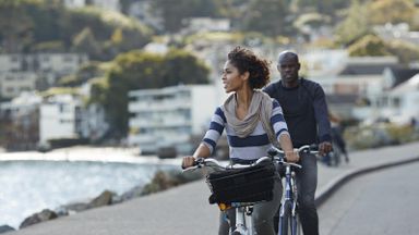 couple with financial flexibility riding bikes