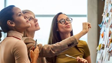 Group of women discussing the difference between a career mentor and a sponsor