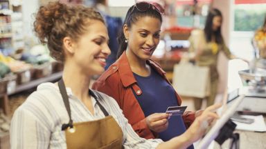 A pregnant woman shopping at a store