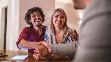 Northwestern Mutual financial advisor helping a young couple optimize their tax strategy in anticipation of the big tax changes coming in 2025.