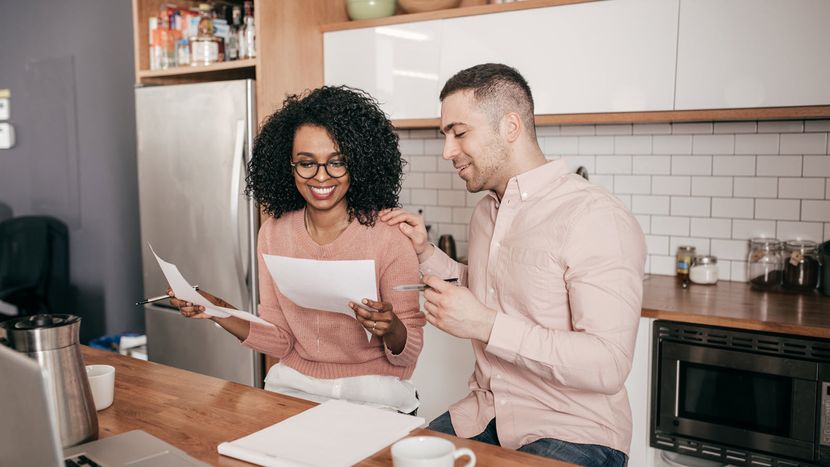 Couple doing their taxes and discussing a strategy to bunch itemized deductions 