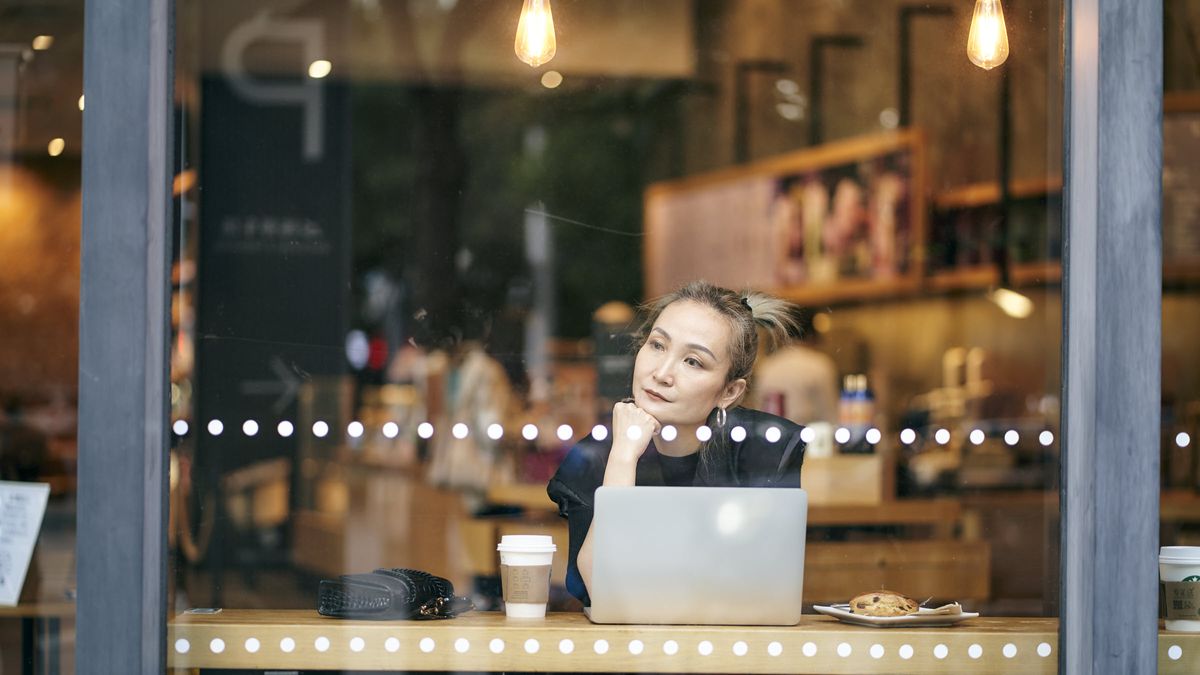 Woman thinking about what she just read in Northwestern Mutual’s Weekly Market Commentary.